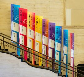 a set of stairs with colorful banners on them